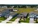 Aerial view of a neighborhood showcasing well-maintained homes, green spaces, and a sense of community at 12407 Hilltop Farms Dr, Dade City, FL 33525