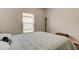 Cozy bedroom with a comfortable bed, neutral tones, and natural light at 12407 Hilltop Farms Dr, Dade City, FL 33525