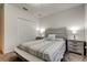 Inviting bedroom with a padded bed, soft lighting, and a spacious closet, creating a relaxing atmosphere at 12407 Hilltop Farms Dr, Dade City, FL 33525