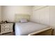 Cozy bedroom with soft lighting, featuring a plush bed, a nightstand, and a closet, ideal for restful nights at 12407 Hilltop Farms Dr, Dade City, FL 33525