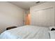 Bedroom featuring neutral bedding, walk in closet and ample space at 12407 Hilltop Farms Dr, Dade City, FL 33525