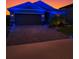Charming home exterior with a well-maintained driveway and festive lighting, creating a welcoming ambiance at 12407 Hilltop Farms Dr, Dade City, FL 33525