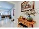 Hallway with tile floors leading to the living and dining areas at 12407 Hilltop Farms Dr, Dade City, FL 33525