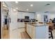 Modern kitchen featuring white cabinetry, granite countertops, and stainless steel appliances at 12407 Hilltop Farms Dr, Dade City, FL 33525