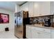 Bright kitchen featuring stainless steel appliances and granite countertops, perfect for cooking and entertaining at 12407 Hilltop Farms Dr, Dade City, FL 33525