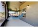 Covered patio with a comfortable hammock and outdoor decor, perfect for relaxation at 12407 Hilltop Farms Dr, Dade City, FL 33525