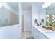 Modern bathroom with a large shower, double vanity, and ample cabinet space at 12905 Brookside Moss Dr, Riverview, FL 33579