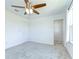 Bedroom featuring a ceiling fan, neutral carpet, and closet at 12905 Brookside Moss Dr, Riverview, FL 33579