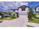 Charming two-story home with a well-manicured lawn and attached two-car garage at 12905 Brookside Moss Dr, Riverview, FL 33579