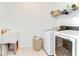 Laundry room featuring white washer and dryer, sink, and storage space at 12905 Brookside Moss Dr, Riverview, FL 33579