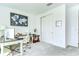 Bright office featuring a desk, chair, and closet at 12905 Brookside Moss Dr, Riverview, FL 33579