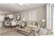 Open-concept living room seamlessly connects to kitchen and dining areas, offering a bright and inviting space at 13084 Stillmont Pl, Tampa, FL 33624