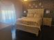Charming bedroom featuring dark wood floors, side tables, and wallpaper at 1400 Gandy N Blvd # 708, St Petersburg, FL 33702