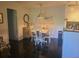 Cozy dining room features dark wood floors, and a modern light fixture at 1400 Gandy N Blvd # 708, St Petersburg, FL 33702