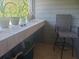 Covered patio features a built-in bar and a single chair at 1400 Gandy N Blvd # 708, St Petersburg, FL 33702
