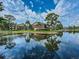 Community pond with fountain and beautiful water reflection of the surrounding apartments at 1400 Gandy N Blvd # 708, St Petersburg, FL 33702