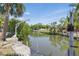 Scenic waterfront property featuring a private boat dock and lush greenery at 1524 Carson Ne Cir, St Petersburg, FL 33703