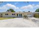 Charming single-story home with a spacious driveway and attached garage at 1524 Carson Ne Cir, St Petersburg, FL 33703