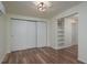Bright bedroom featuring built-in shelving and a spacious closet at 1606 S Arrawana Ave, Tampa, FL 33629