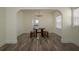 Traditional dining room with wood floors, chandelier, round table and bench seating at 1606 S Arrawana Ave, Tampa, FL 33629