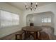 Dining area featuring a round wood table with bench seating near fireplace at 1606 S Arrawana Ave, Tampa, FL 33629