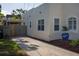 Spacious driveway and side view of a single-Gathering home with access to a screened-in area at 1606 S Arrawana Ave, Tampa, FL 33629