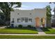 Lovely single-Gathering home with a well-kept lawn, large window, and an inviting arched doorway at 1606 S Arrawana Ave, Tampa, FL 33629