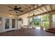 Enclosed patio offers outdoor seating with screened walls and dual ceiling fans at 1606 S Arrawana Ave, Tampa, FL 33629