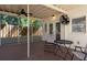 Relaxing screened-in patio with ceiling fans and comfortable seating, perfect for enjoying the outdoors at 1606 S Arrawana Ave, Tampa, FL 33629