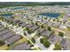 An aerial shot of a vibrant residential neighborhood with homes, ponds, and lush landscaping at 16313 Treasure Point Dr, Wimauma, FL 33598
