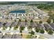 An aerial view showcases the residential community and beautiful ponds at 16313 Treasure Point Dr, Wimauma, FL 33598