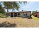 The backyard features a screened porch and outdoor seating area at 16313 Treasure Point Dr, Wimauma, FL 33598