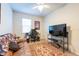 Bedroom featuring neutral color scheme, ceiling fan, and comfortable seating at 16313 Treasure Point Dr, Wimauma, FL 33598