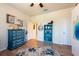 Bright bedroom features laminate flooring, decorative furniture, and an abundance of natural light at 16313 Treasure Point Dr, Wimauma, FL 33598