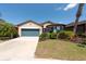 Charming single-story home with manicured landscaping at 16313 Treasure Point Dr, Wimauma, FL 33598