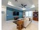 Inviting living room showcasing stylish decor, paneling, and an open layout with plenty of natural light at 16313 Treasure Point Dr, Wimauma, FL 33598