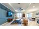 Inviting living room showcasing stylish decor, paneling, and an open layout with plenty of natural light at 16313 Treasure Point Dr, Wimauma, FL 33598