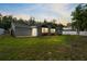 A beautifully maintained backyard featuring a lush lawn and modern home exterior at 16411 Lake Byrd Dr, Tampa, FL 33618
