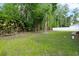 Lush backyard featuring a privacy fence and mature landscaping at 16411 Lake Byrd Dr, Tampa, FL 33618