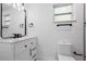 Bathroom featuring modern vanity, toilet and black fixtures at 16411 Lake Byrd Dr, Tampa, FL 33618