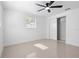 Bedroom featuring a ceiling fan, window, and closet at 16411 Lake Byrd Dr, Tampa, FL 33618