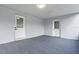 Bright and spacious carport with fresh paint, modern flooring, and side door access at 16411 Lake Byrd Dr, Tampa, FL 33618
