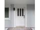 Elegant front door with decorative glass, modern hardware, and a smart lock at 16411 Lake Byrd Dr, Tampa, FL 33618
