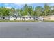 Charming single-story home with a well-maintained lawn and a covered carport at 16411 Lake Byrd Dr, Tampa, FL 33618