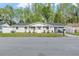 Charming single-story home with a well-manicured lawn and inviting front entrance, exuding curb appeal at 16411 Lake Byrd Dr, Tampa, FL 33618