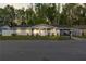 Charming single story home with well maintained yard, welcoming front porch and driveway at 16411 Lake Byrd Dr, Tampa, FL 33618