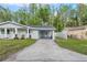 Attractive single-story home with a side carport and manicured lawn at 16411 Lake Byrd Dr, Tampa, FL 33618