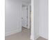 Hallway with tile floors and a doorway leading to another room in the house at 16411 Lake Byrd Dr, Tampa, FL 33618