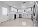 Updated kitchen features stainless steel appliances, wine cooler, and white cabinets at 16411 Lake Byrd Dr, Tampa, FL 33618