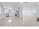 Bright kitchen with stainless steel appliances, ample counter space, and sleek white cabinetry at 16411 Lake Byrd Dr, Tampa, FL 33618